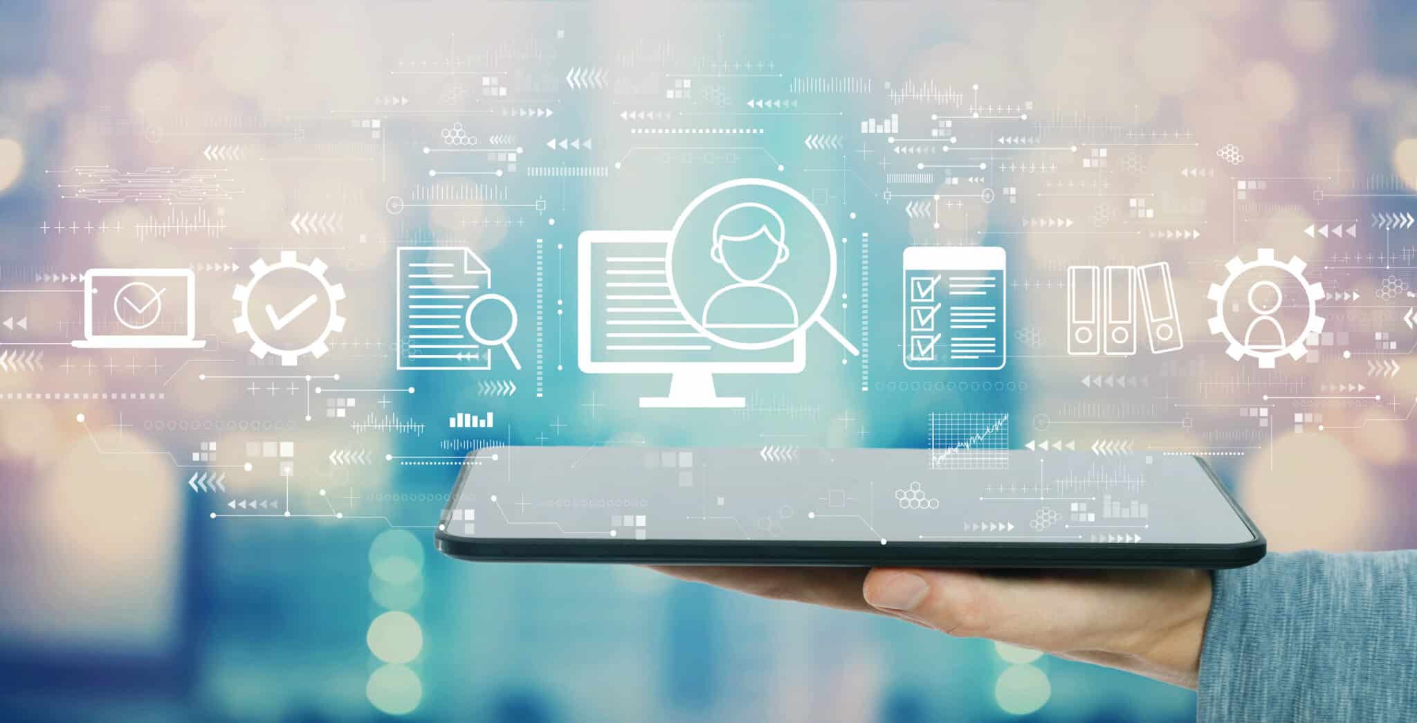 Document management system concept with man holding a tablet computer